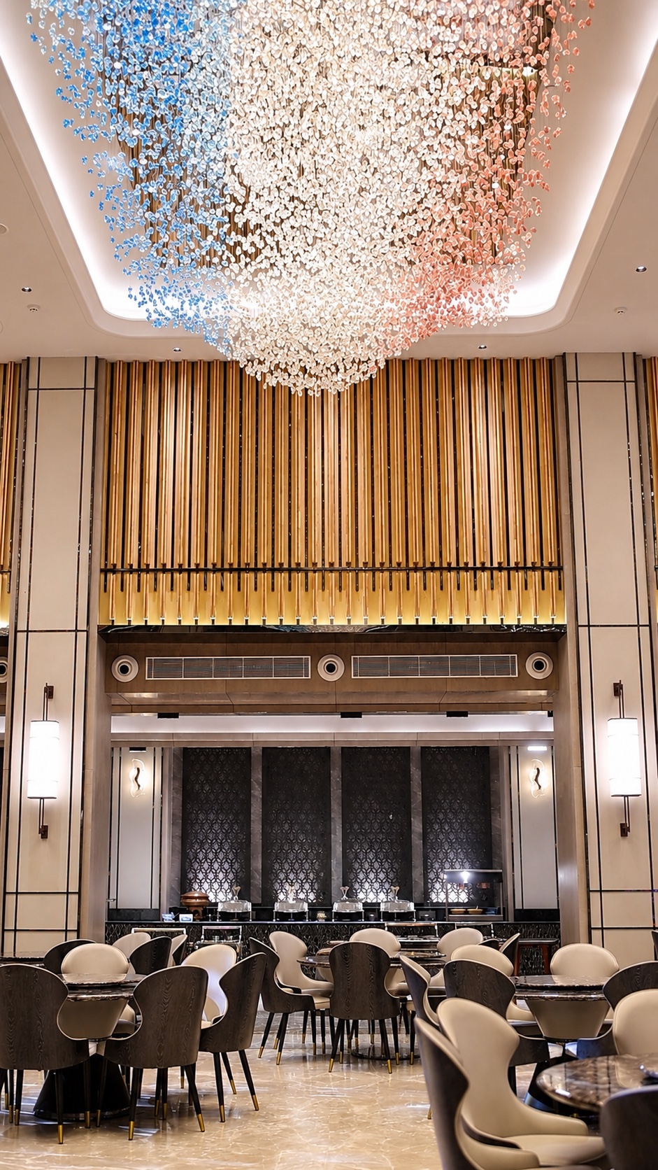 Bright symmetrical view of Aroha Hall beneath its crystal ceiling installation
