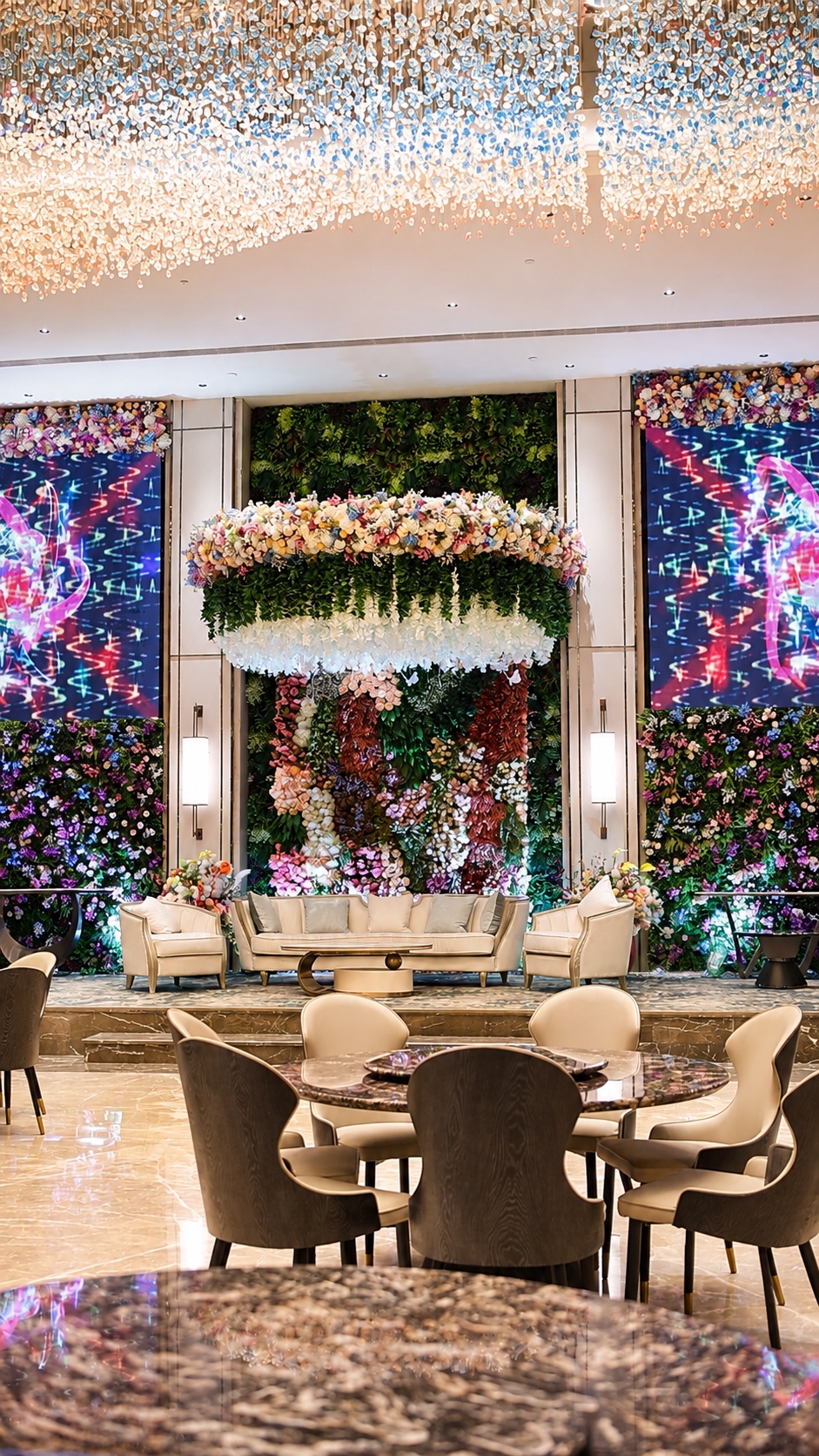 Front-facing view of Aroha Hall's floral stage and dining area